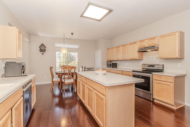 kitchen featuring light brown cabinets, under cabinet range hood, dark wood finished floors, light countertops, and stainless steel appliances