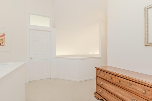 bedroom with light colored carpet