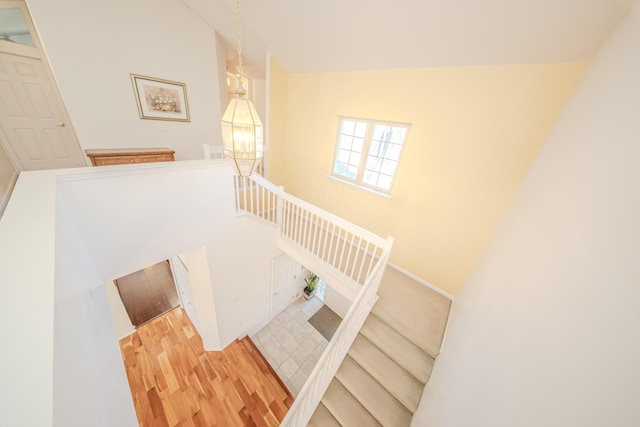 stairway with wood finished floors