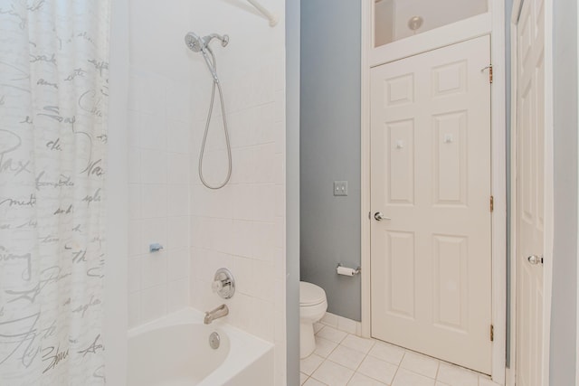 full bathroom with tile patterned flooring, toilet, baseboards, and shower / bath combo with shower curtain