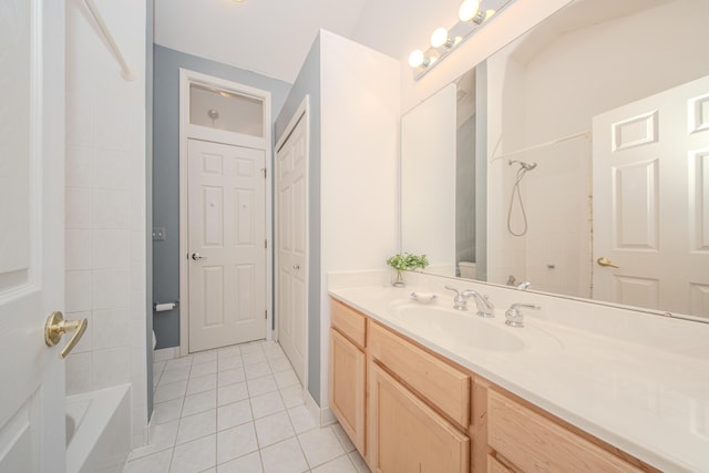 bathroom with tile patterned floors, shower / bath combination, and vanity