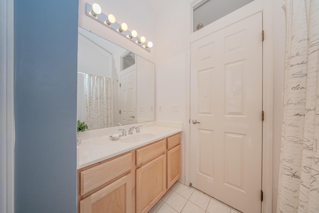 full bath with tile patterned flooring and vanity