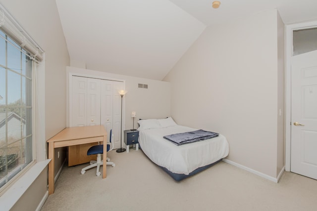 bedroom featuring baseboards, visible vents, lofted ceiling, and light carpet