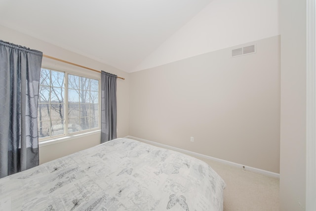 bedroom with visible vents, baseboards, carpet, and vaulted ceiling