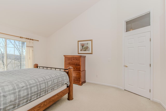 bedroom with light carpet, baseboards, lofted ceiling, and access to outside