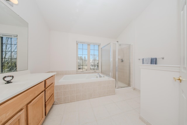 full bath with tile patterned floors, vanity, a garden tub, and a shower stall