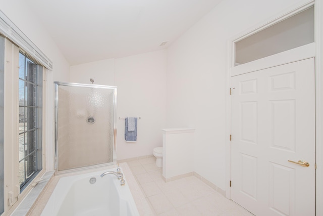 full bath featuring a bath, a shower stall, tile patterned floors, and toilet