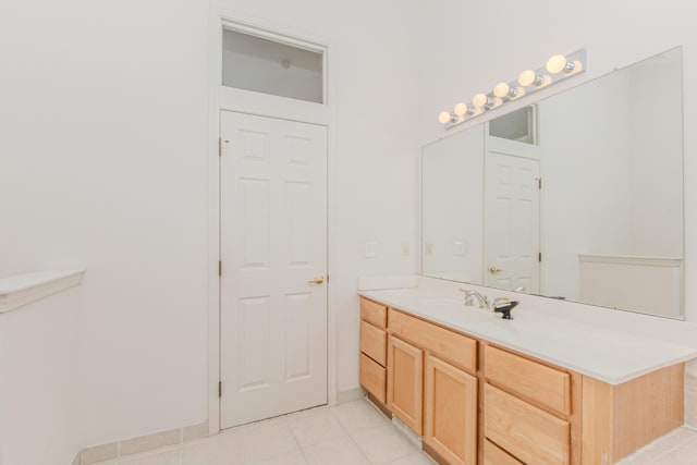 bathroom with tile patterned floors and vanity