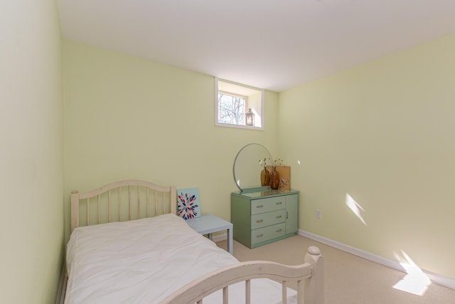 bedroom featuring baseboards and carpet floors