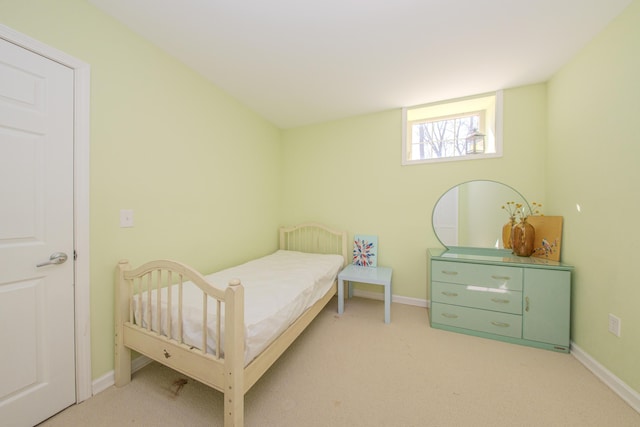 bedroom featuring carpet flooring and baseboards