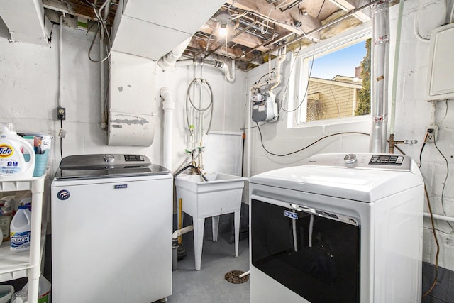 laundry room featuring independent washer and dryer and laundry area