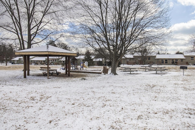 snowy yard featuring a gazebo