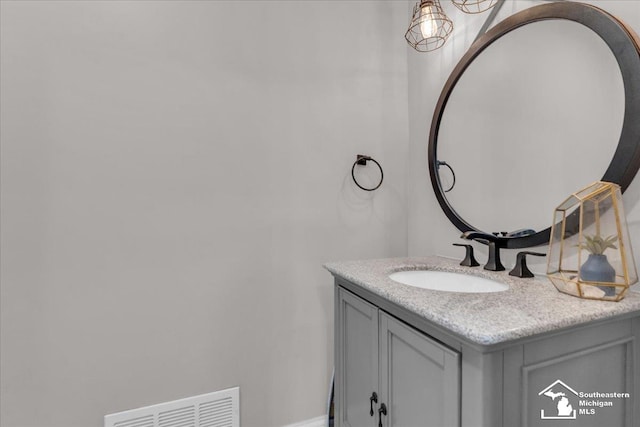 bathroom featuring visible vents and vanity