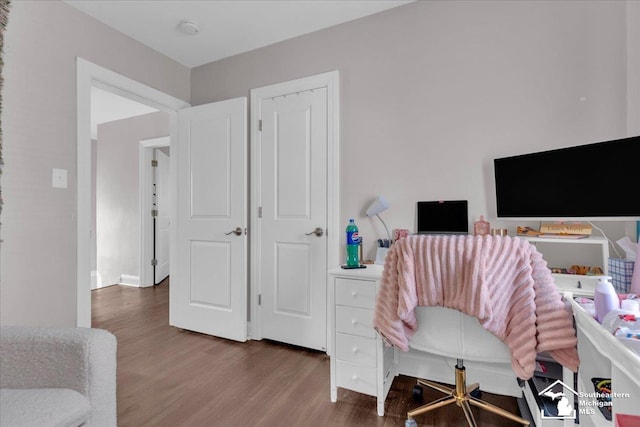 home office with wood finished floors