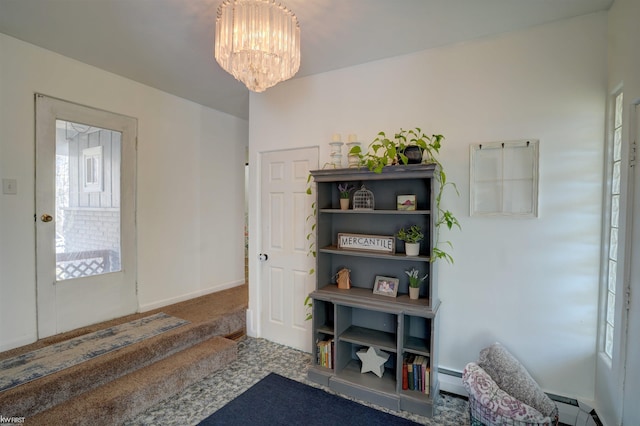 carpeted foyer entrance with an inviting chandelier, baseboards, and baseboard heating