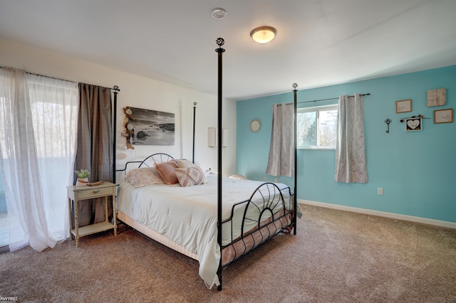 bedroom with carpet flooring and baseboards