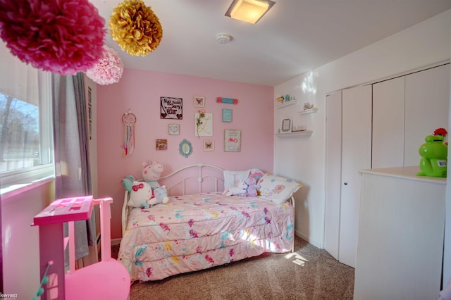 bedroom with a closet and carpet floors