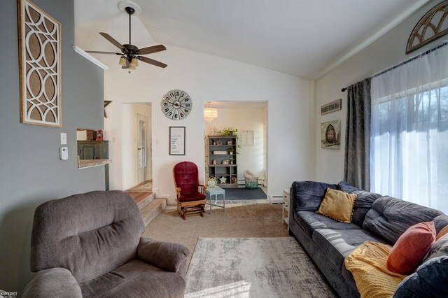 living area featuring carpet floors, a baseboard heating unit, ceiling fan, and vaulted ceiling