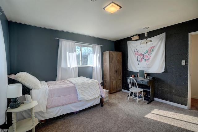 carpeted bedroom with baseboards