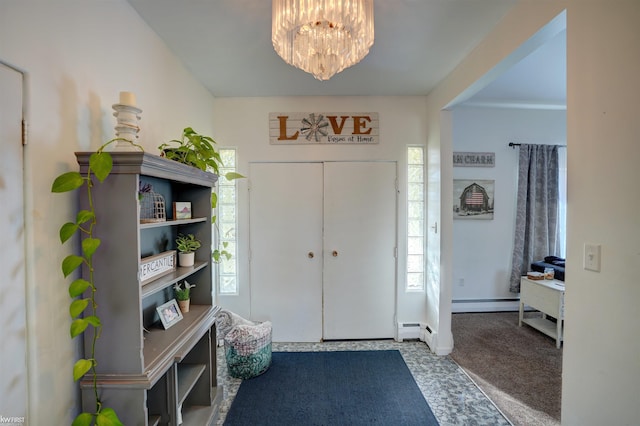 foyer featuring a baseboard heating unit, baseboards, carpet floors, baseboard heating, and an inviting chandelier