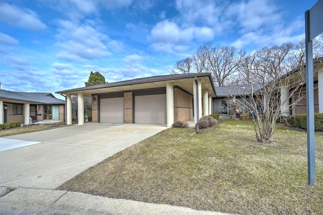 view of front of home with a garage, a front lawn, brick siding, and driveway