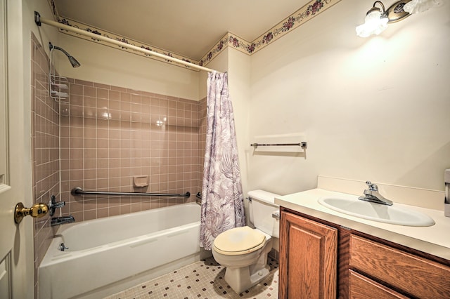 bathroom with vanity, tile patterned floors, toilet, and shower / bath combo