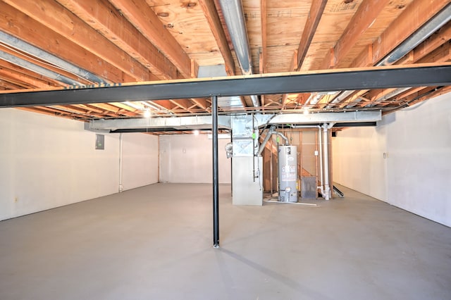 unfinished basement featuring heating unit and gas water heater