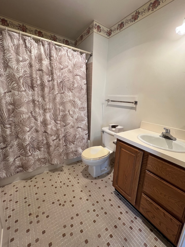 bathroom with toilet, vanity, and shower / bath combination with curtain