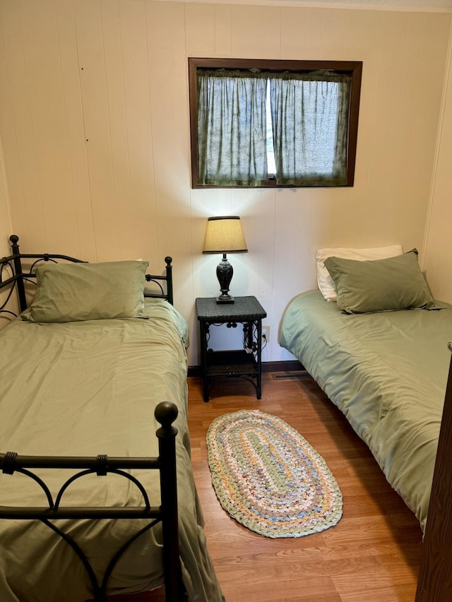 bedroom featuring wood finished floors