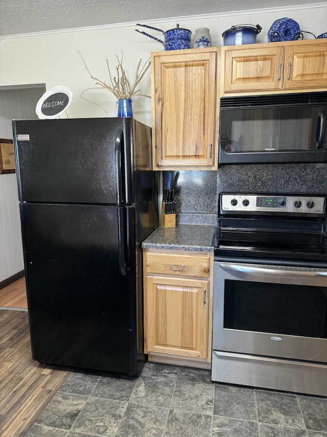 kitchen featuring decorative backsplash, a textured ceiling, and black appliances