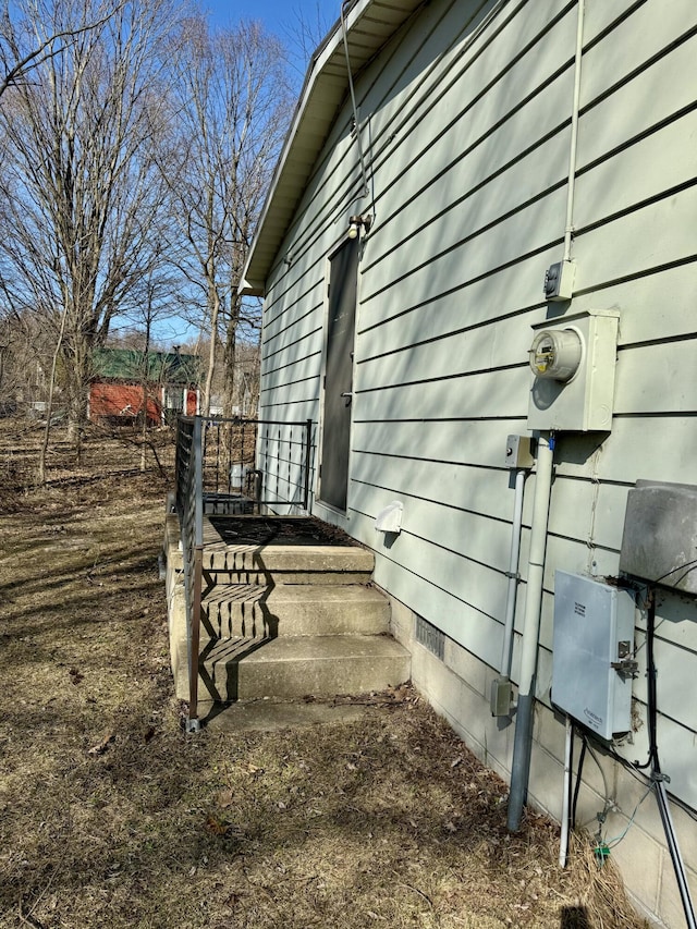 view of property exterior with crawl space