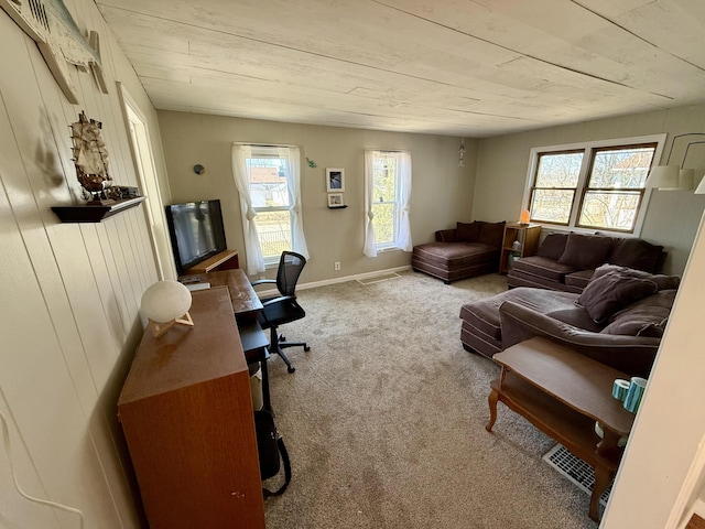 office featuring baseboards, carpet floors, and visible vents