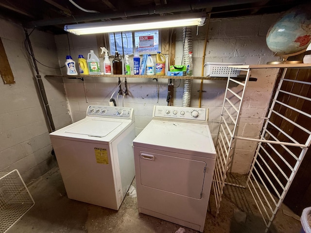 laundry room with laundry area and washing machine and clothes dryer