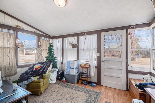 sunroom / solarium with lofted ceiling