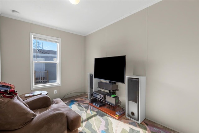 living area featuring light wood-style floors and ornamental molding