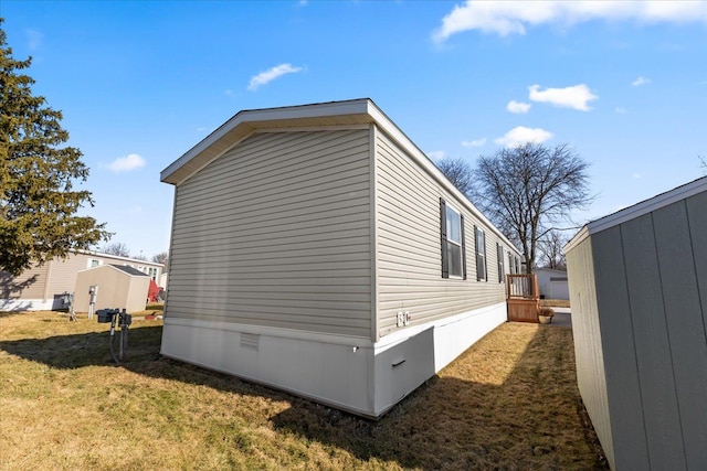 view of property exterior featuring a lawn