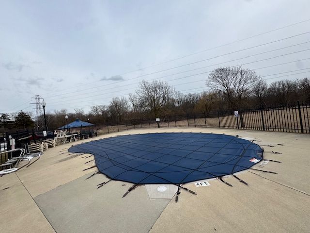 community pool featuring a patio and fence