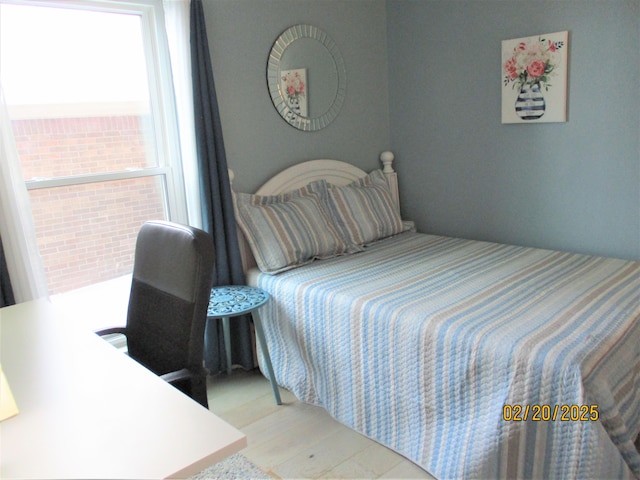 bedroom featuring wood finished floors