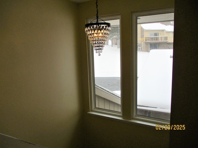 interior details featuring a notable chandelier