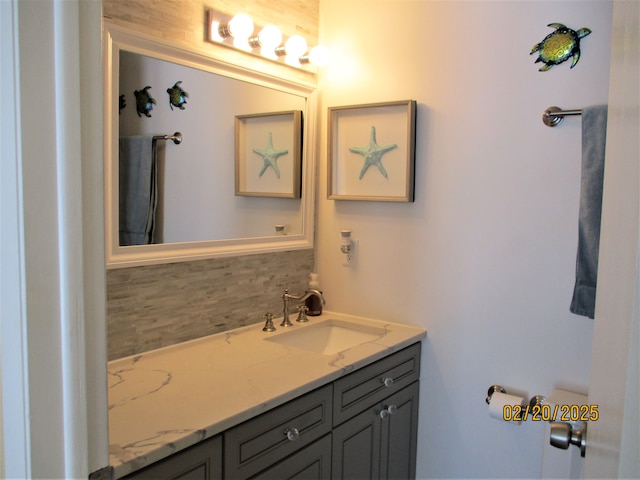 bathroom featuring backsplash and vanity