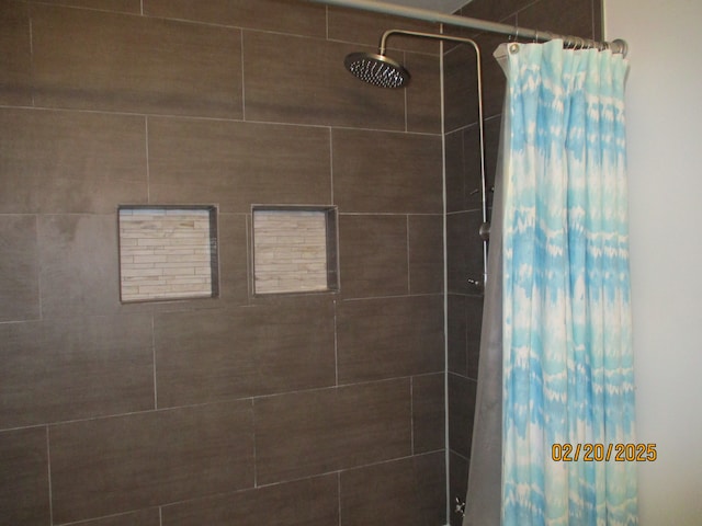 bathroom with a tile shower