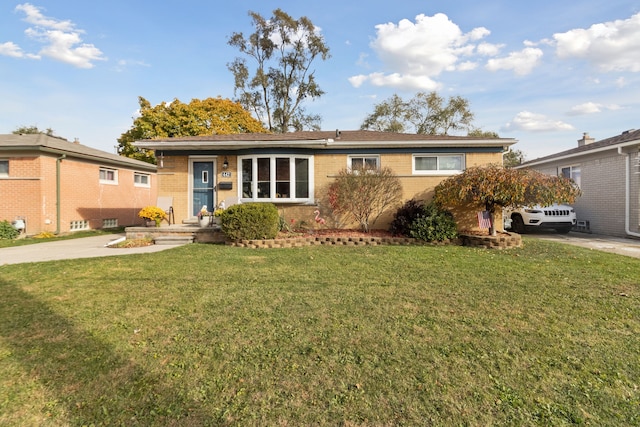 single story home with brick siding and a front lawn