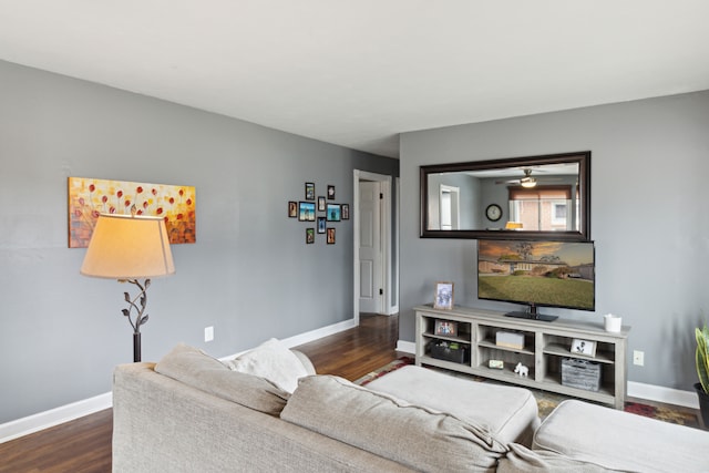 living area with dark wood-style floors and baseboards