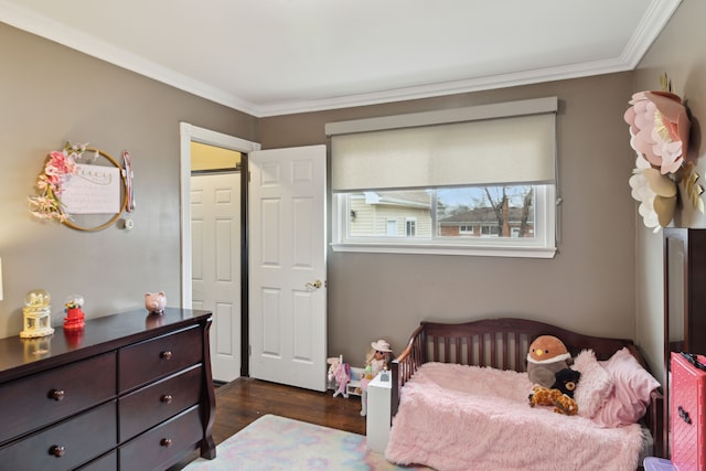 bedroom with dark wood finished floors and ornamental molding