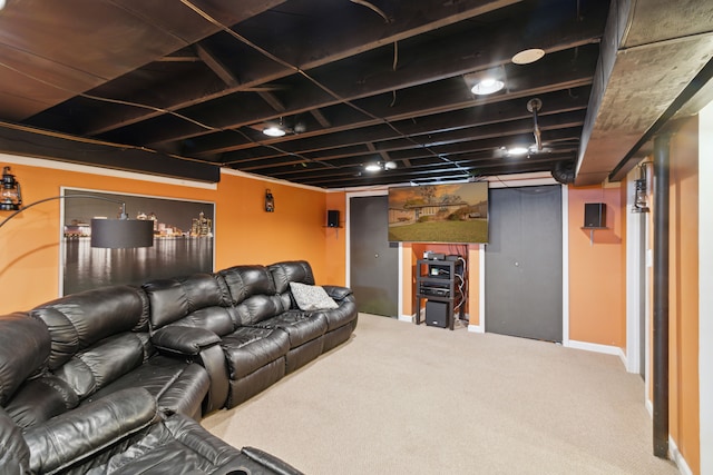 cinema room with baseboards and carpet floors