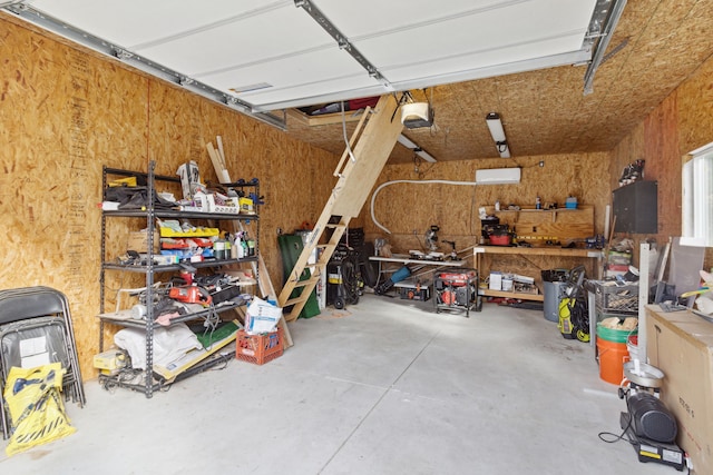 garage featuring a workshop area and a garage door opener