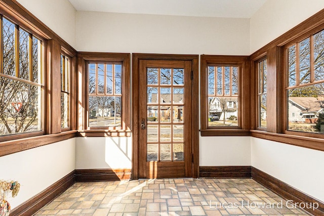 unfurnished sunroom with plenty of natural light