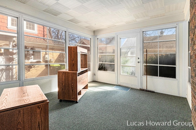 unfurnished sunroom featuring a wealth of natural light