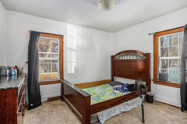 carpeted bedroom with baseboards