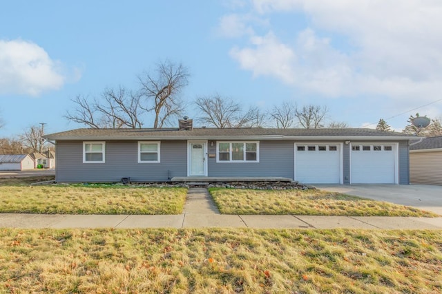 ranch-style house featuring a garage, a front lawn, a chimney, and driveway